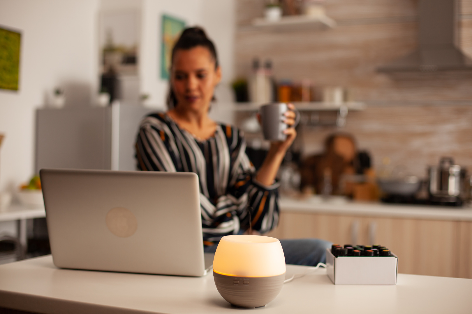 drinking-coffe-working-with-aromatherapy-with-essential-oils-from-diffuser.jpg
